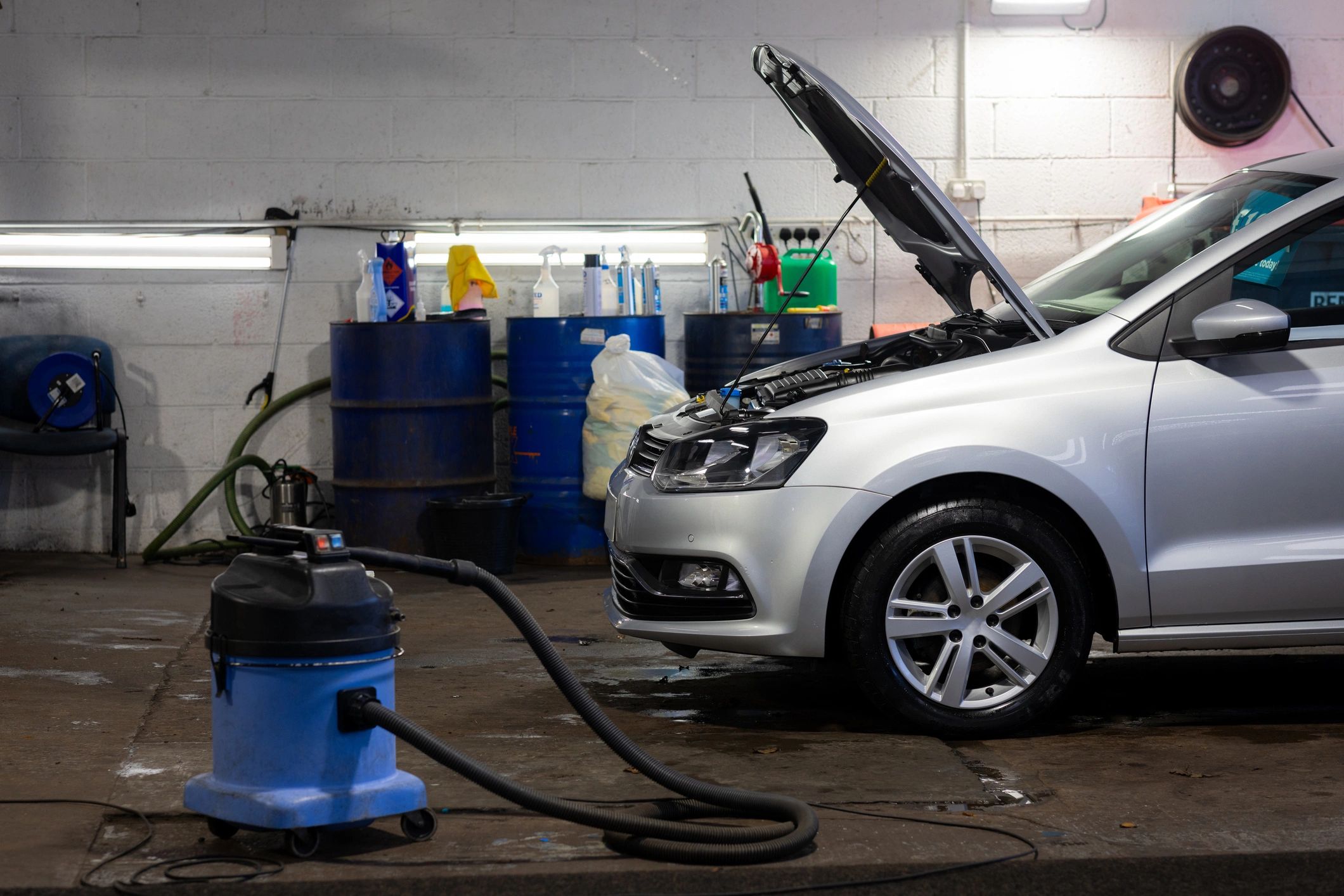 Vehicle being serviced inside an auto repair garage